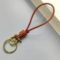 Brown leather braided keychain with brass horseshoe buckle for car key organization - Distressed Brown Leather Rope Bronze Horseshoe Buckle
