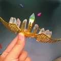 Macro detail of handmade gold wire hair crown with moon, wings, and natural crystals - White Crystal + Gold Wing Moon