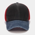 Detail of distressed brim and breathable mesh on a color-block vintage trucker hat - Black and Navy Blue