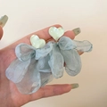 Detailed shot of floral earrings with light green resin hearts and blue mesh bow pendants - Bow (2#)
