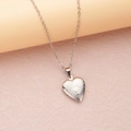 Silver-finished heart locket necklace with vintage floral carvings on sleek stone surface - Steel Heart in Heart (22*19mm)