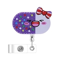 Detailed close-up of a retractable acrylic badge holder in a purple glitter pill shape - Pill