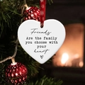 Close-up of heart-shaped ceramic ornament with friendship quote on a Christmas tree - Friends Are The Family You Choose With Your Heart (2)