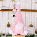 Pink knit Christmas gnome doll with white dots and plush beard on a wood base - Pink
