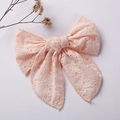 Pink embroidered lace bow hair clip for girls on a clean minimalist background - Pink