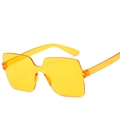 Modern rimless square sunglasses with oversized translucent orange one-piece lenses - Night Vision Yellow
