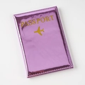 Close-up of metallic pink passport cover with gold lettering and stitched edges - Rose Red / 14×10cm