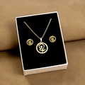 Detailed view of golden floral necklace and earrings set in a white gift box - Hollow Flower