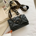 Black quilted crossbody bag with gold-patterned wide strap and chic resin chain - Black
