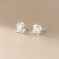 Detailed view of silver bow stud earrings with intricate filigree openwork and texture - EH0586/Silver Filigree Bow Stud