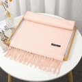 Soft light pink faux cashmere scarf with tassels and stitched label on wooden tray - Pale Green