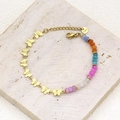 Detailed close-up of colorful faceted beads and a gold butterfly pendant on a steel bracelet - Style 4 (Butterfly Charm/Multicolor Faceted Beads)