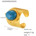 Macro detail of gold stainless steel ring featuring oval turquoise and embossed texture - US 7 / Turquoise Gold Granulated Open Ring (A532)