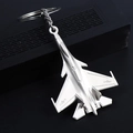 Silver matte fighter jet airplane keychain model placed on a dark wooden gift box - Silver J-15 Fighter Jet
