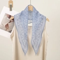 Classic blue paisley bandana scarf styled on a beige top for a retro American aesthetic - Dark Blue