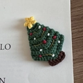 Detail of handcrafted crochet Christmas tree hair clip with festive star and bead accents - Christmas Series - Dark Green Tree
