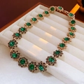 Vintage style floral necklace with green gemstones in a white velvet jewelry box - Vintage Flower Necklace - Green