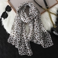 Classic leopard print long chiffon scarf in brown and black on a luxury plush background - Classic Leopard