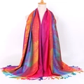 Ethnic jacquard scarf with colorful feather pattern and fringe trim on a mannequin - Rose Red