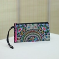 Ethnic embroidered clutch bag in black satin with floral patterns and pink tassel charm - Flower Whisper