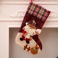 Red Christmas stocking with plush Santa Claus and reindeer design on a white fireplace - Plaid Extra Large Stocking (Santa Style)