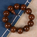 Close-up of dark brown sandalwood prayer beads showing natural wood grain and tassel - Exquisite Small Hole / 20mm*12 Beads