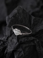 Detailed view of an open silver ring with a white heart-shaped gemstone on black paper - Heart Style (NR298)