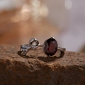Macro view of S925 silver garnet ring with red stone and diamond bow detail on stone - Natural Garnet Bow Ring LR393