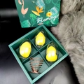 Green gift box with yellow makeup sponges in shells and a rose gold metal holder - Light Yellow