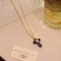 Close-up of a gold cross necklace with black stone and pink marquise gem detail - Snowflake Obsidian Pink Gem Style (7# Snowflake)