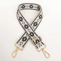 Detail of 3.8cm jacquard canvas bag strap with black geometric pattern and gold hooks - Beige Black Gold Hook