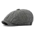 Classic herringbone tweed newsboy cap for men and women in grey 45-degree side view - One Size / White