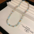 Vintage ceramic beaded necklace with blue and brown marble beads and gold toggle clasp - Marble Texture/Vintage Blue-Brown