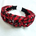 Western style red and black checkered headband with white snowflake patterns and top knot - Red Black Snowflake Woven Plaid