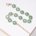 Daisy charm bracelet with blue enamel flowers and golden chain in a sweet style - Green