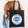 Black canvas tote bag with Greek Evil Eye print and Good Things Take Time text - Design R-Quote Eye-Black