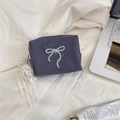 Close-up of purple bow makeup bag with white lace ribbon on aesthetic fabric - Grey with Lace