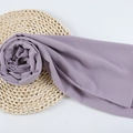Lavender chiffon hijab scarf with pearl sand texture displayed on a woven mat - 95