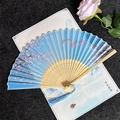 Classic blue folding fan with pink cherry blossoms, butterflies and a blue silk tassel - Butterflies Flying - Sky Blue