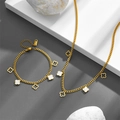 Gold stainless steel jewelry set with clover pendants including a necklace and bracelet - Clover Jewelry Set A703-N208