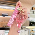 Pink Bubble floating keychain with dried flowers, silicone strap and gold bell - Oil-filled Flower - Pink