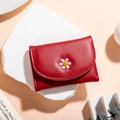 Red tri-fold faux leather wallet featuring a small pink daisy flower decoration - Burgundy
