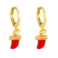 Macro view of gold hoop earrings with red horn pendants and sparkling micro zircon accents - Red