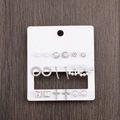 Nine pairs of silver alloy stud earrings with pearls and rhinestones on a card - Pearl Hoop Fishtail Cross 9 Pairs Earring Set