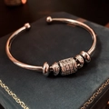 Detail of silver open bangle with pavé zircon beads on blue velvet jewelry box - Micro Pave Zirconia Geometric Open Bangle / Silver