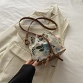 Vintage floral jacquard bucket bag with brown leather base and drawstring closure - Off-white Floral