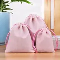 Three sizes of premium pink velvet drawstring pouches for jewelry gift packaging - Pink