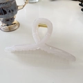 Top view of large 15cm pink resin shark hair claw clip with golden metal spring on desk - Hanger (Approx 15cm) / Jelly White