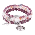 Close-up of tree of life and feather charms on bohemian turquoise beaded bracelets set - Purple Lepidolite