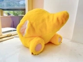 Rear view of yellow plush milk dragon toy with soft fabric and pink paw details - 35cm Little Dinosaur Butt Hand Warmer (DA633)